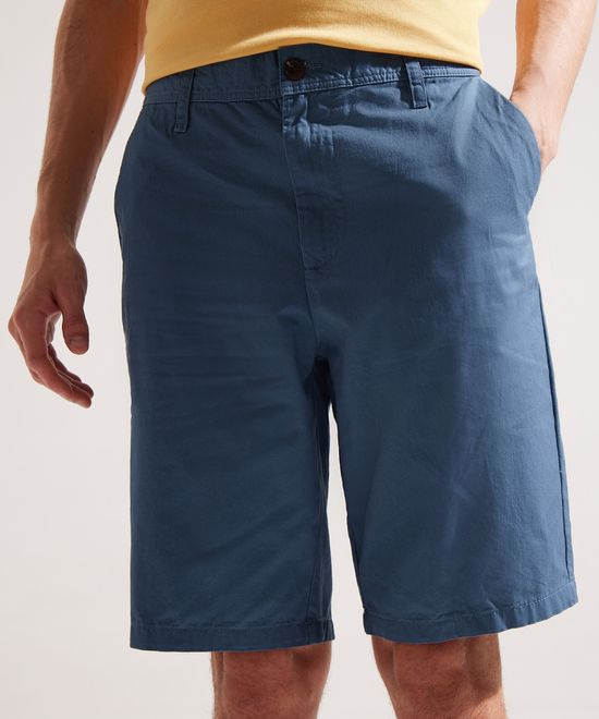 Pantalón corto para Niño en color amarillo con cinturón azul marino
